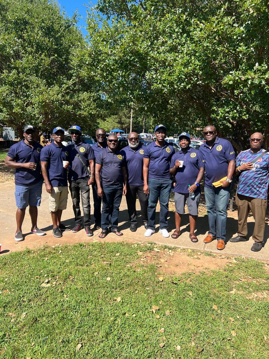 Akatakyie members in navy chapter polos at an outdoor reunion in Atlanta